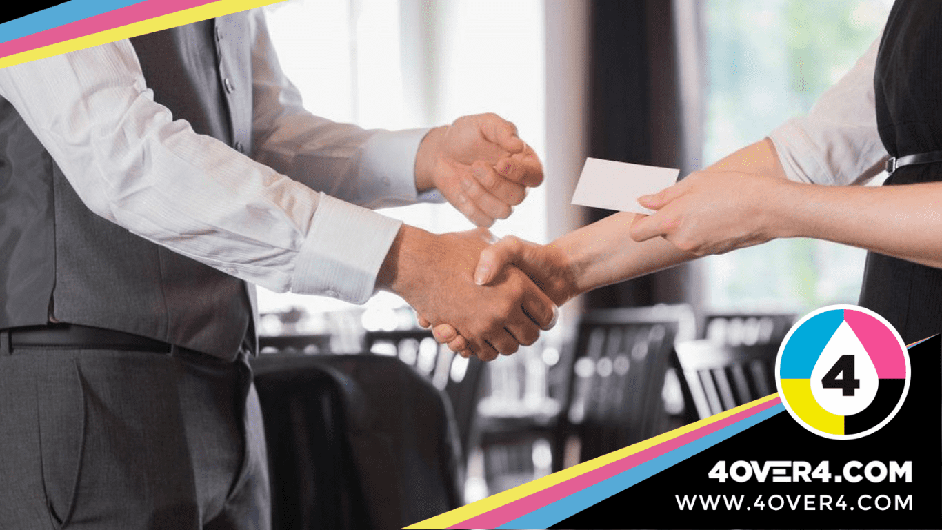 Shaking hands while exchanging visiting card